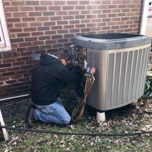Boelcke technician performing air conditioning repair