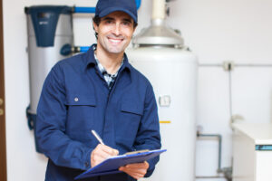 Technician servicing a hot-water heater